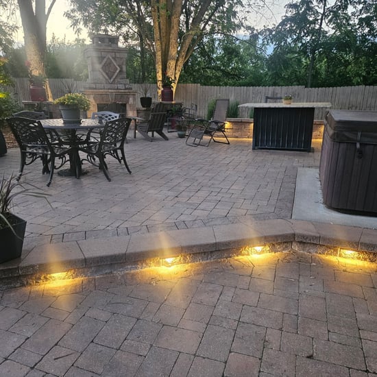Deck and patio lighting installation providing warm evening illumination for outdoor living spaces Deck and patio lighting installation providing warm evening illumination for outdoor living spaces