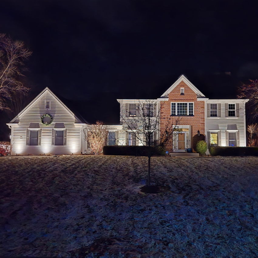 Front yard landscape lighting highlighting a home’s architecture and trees in Waukesha Wisconsin Front yard landscape lighting highlighting a home’s architecture and trees in Waukesha Wisconsin