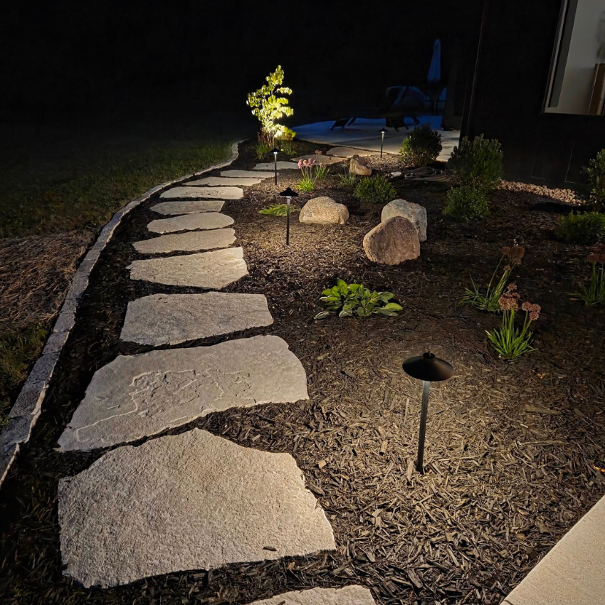 Pathway lighting guiding a residential walkway with low-voltage landscape lighting Pathway lighting guiding a residential walkway with low-voltage landscape lighting